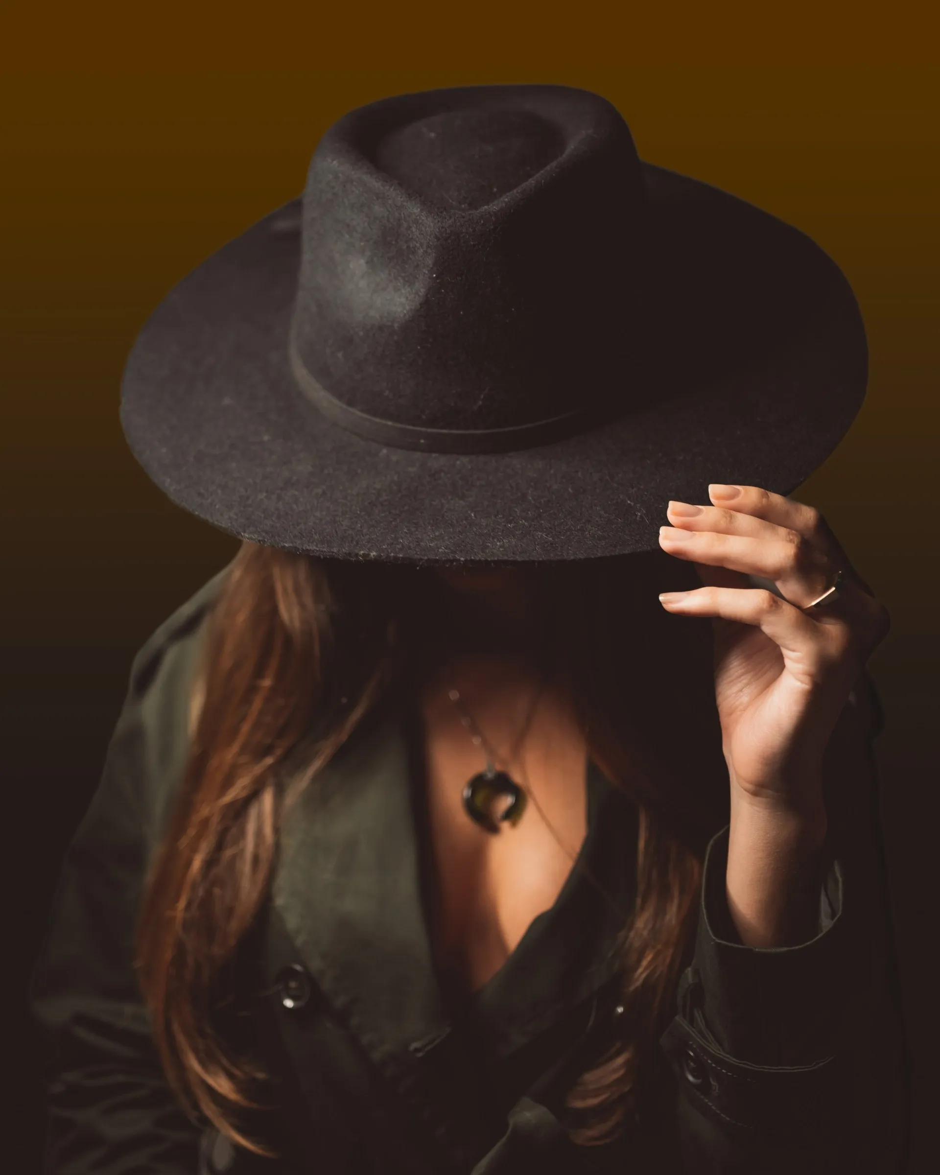 Simone Liberty in a wide-brimmed hat